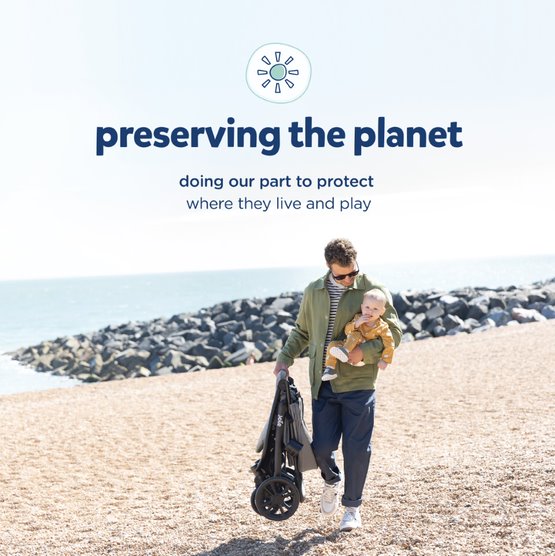 Dad walking with baby on beach