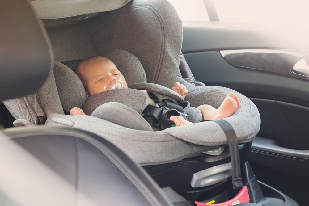Asian,Cute,Newborn,Baby,Sleeping,In,Modern,Car,Seat.,Child